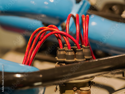 Detail of a distributor on a vintage car engine.