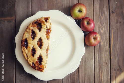 An Apple pie on a wooden table