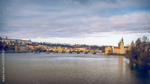 Photography A panorama of historic Prague and Charles Bridge over the Vltava River