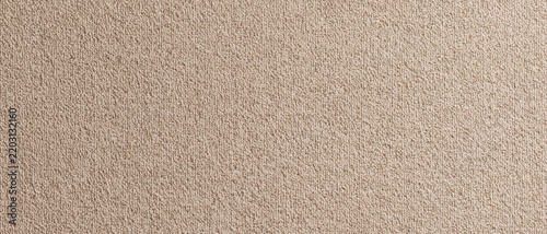 Seamless Textured Background of a Soft Beige Loop Pile Carpet, Evoking Warmth and Comfort, Ideal for Interior Design Concepts and Textile Product Showcases