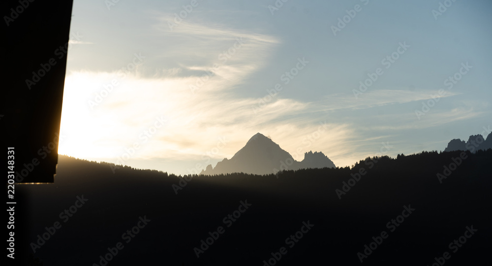Obraz premium Summer view of the Mont Blanc massif above forested slopes 