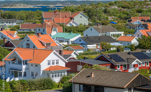 Traditional Swedish coastal neighborhood with colorful tiled roof houses.