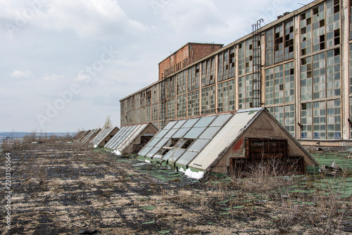Old, abandoned industrial power plant building with broken windows