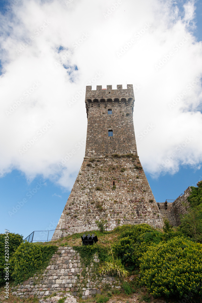 Fototapeta premium Tower of the medieval fortress of Radicofani, an imposing historic landmark overlooking the Val d’Orcia landscape in southern Tuscany, Italy.