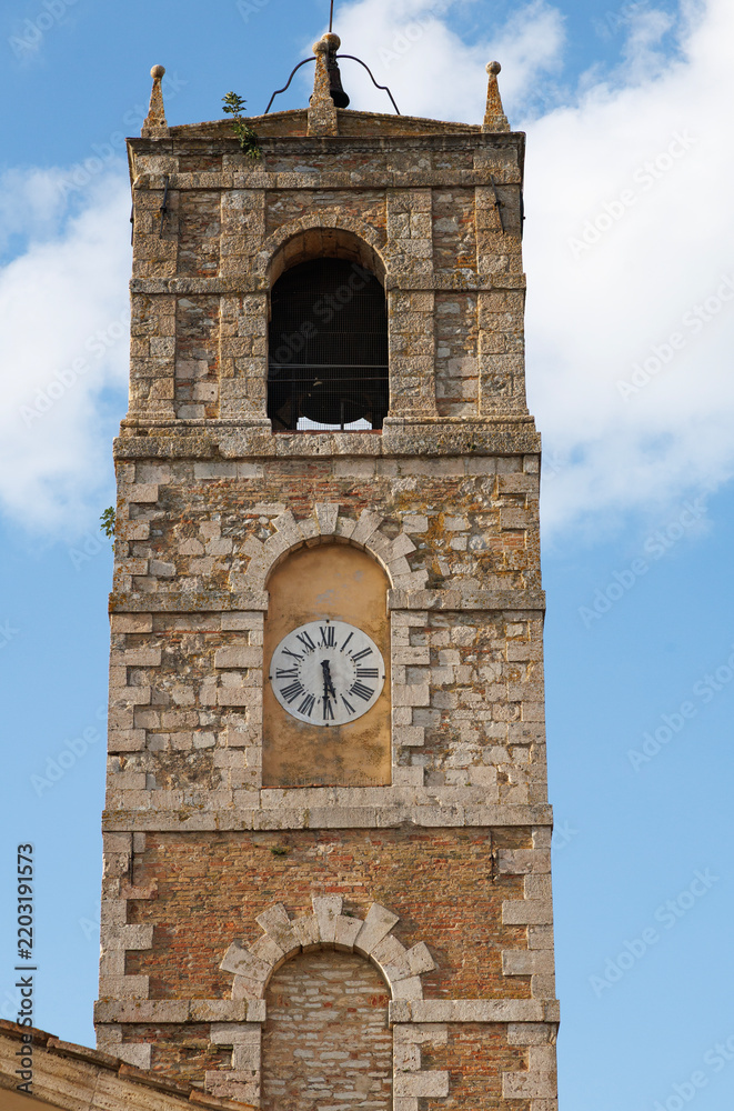 Fototapeta premium Bell tower of the Collegiate Church of Saints Leonard and Cassian in San Casciano dei Bagni, a historic Tuscan village in the province of Siena, Italy.