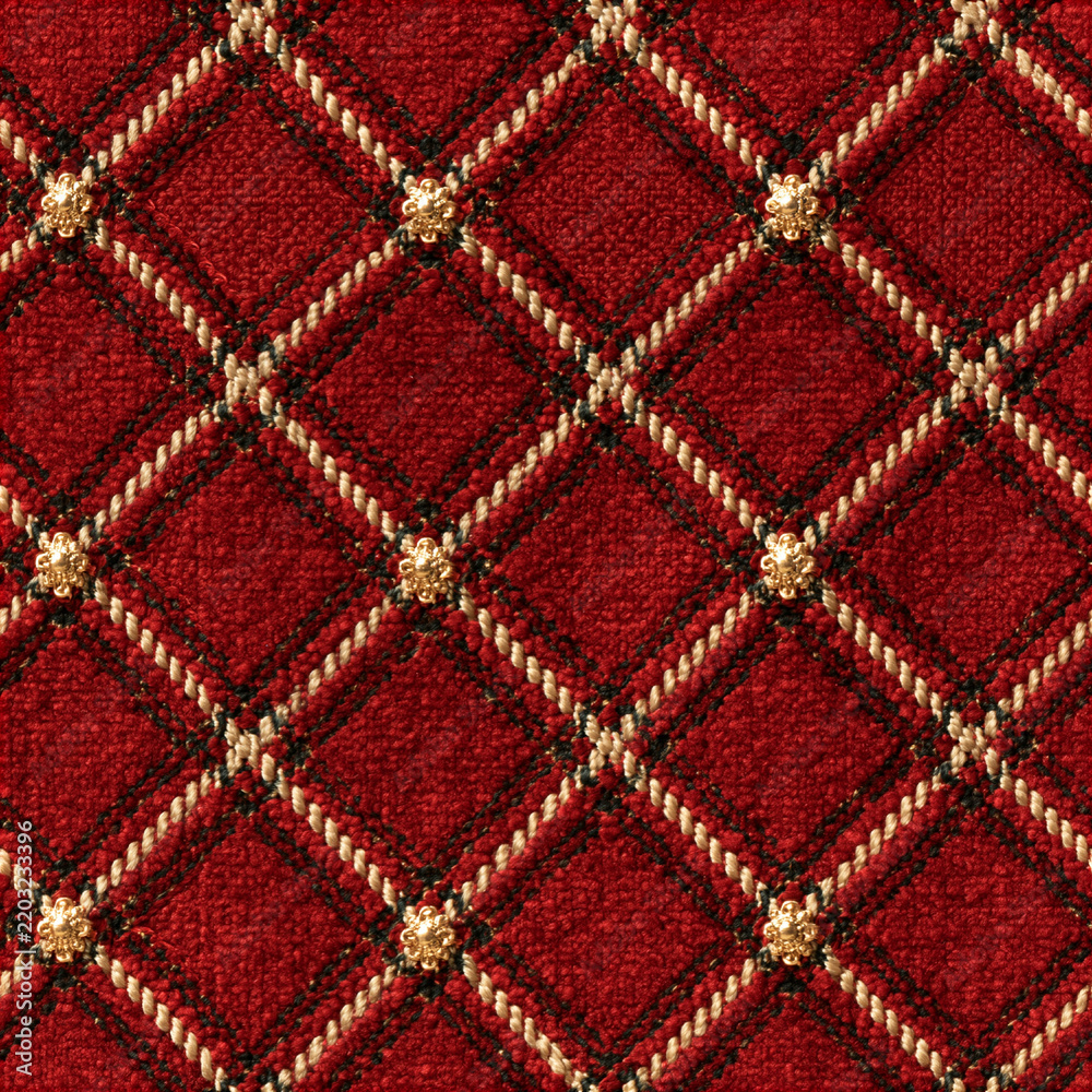 Obraz premium Seamless pattern red fabric texture forming a quilted diamond pattern, featuring woven ropes and ornate gold buttons at intersections, conveying luxury