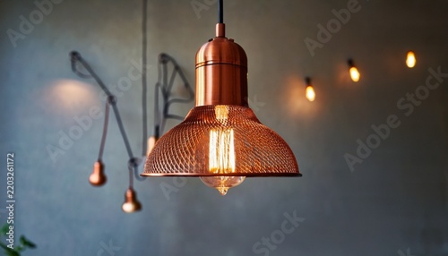 copper pendant lamp with glowing bulb indoors