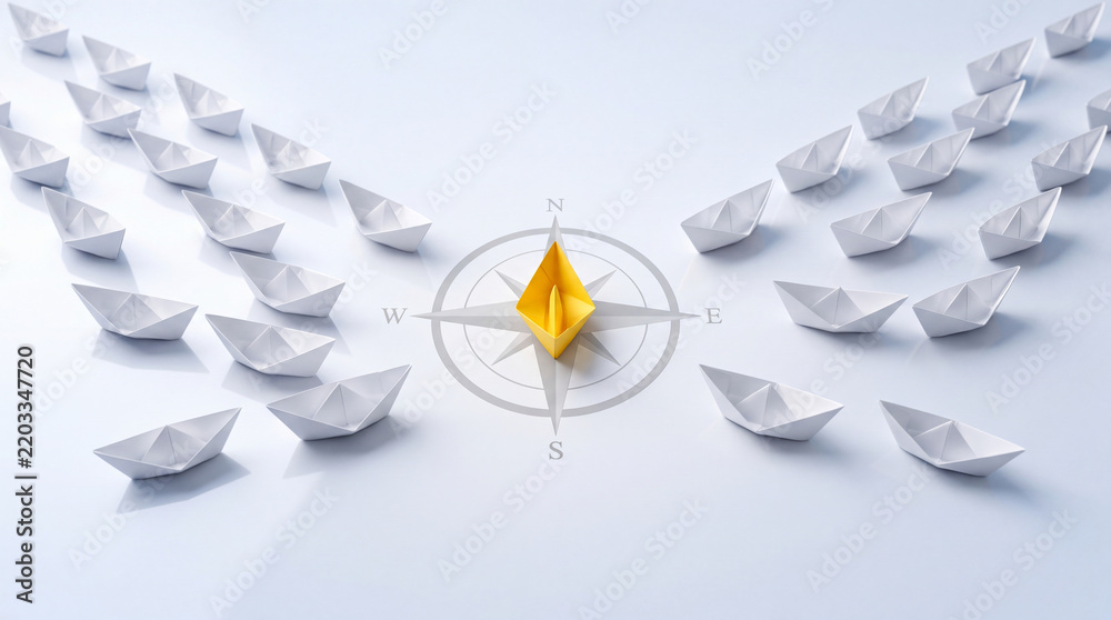 Fototapeta premium Leadership concept with unique yellow paper boat navigating on a compass rose followed by a group of white boats representing business vision, guidance, and strategic direction on white background
