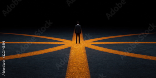 Businessman standing at intersection of glowing orange paths in dark environment representing strategic decision making and career direction