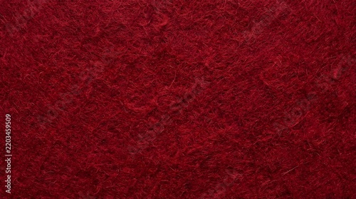Deep red felt fabric texture background with soft fibers and rich crimson color