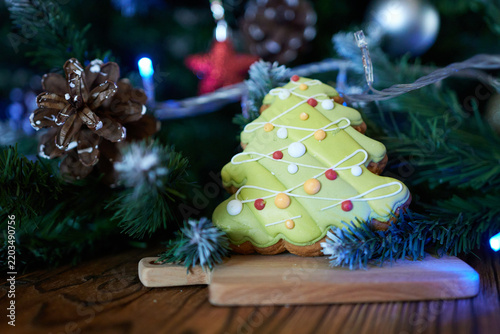 Christmas tree cookies on a wooden background. Christmas and New Year concept.
