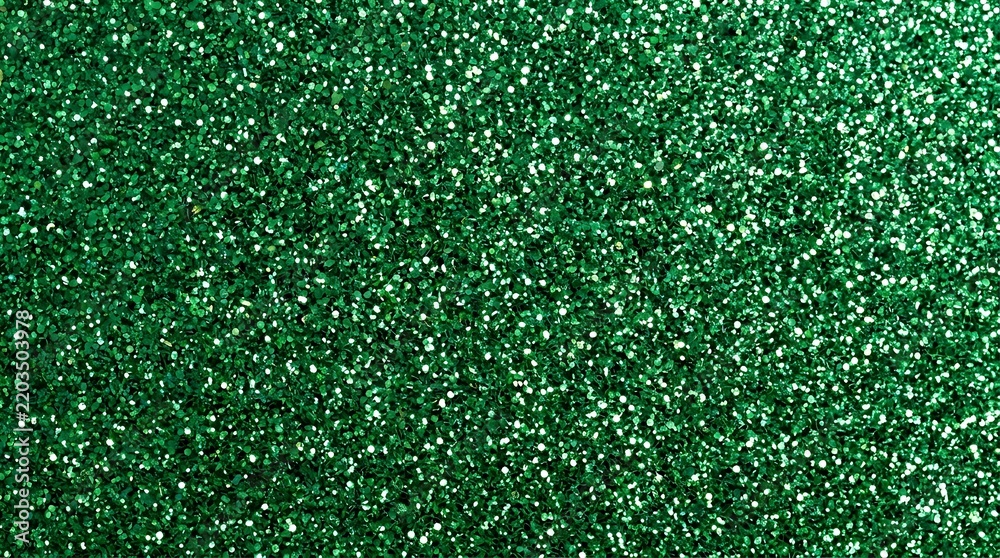 Fototapeta premium Vibrant emerald green glitter texture background featuring sparkling particles and festive holiday decorative shiny surface effect