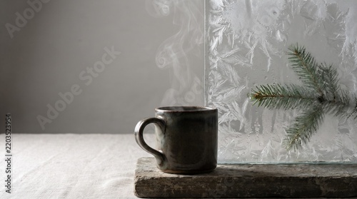 Cozy Winter Coffee Cup with Frosted Window and Pine Branch