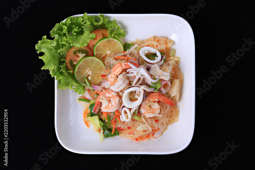 Spicy Glass Noodle Salad with Seafood. Food photography for use in menus
