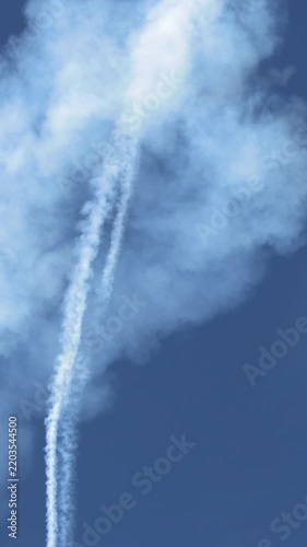 Aerobatic Stunt Plane Diving Downward Leaving Thick White Smoke Trail