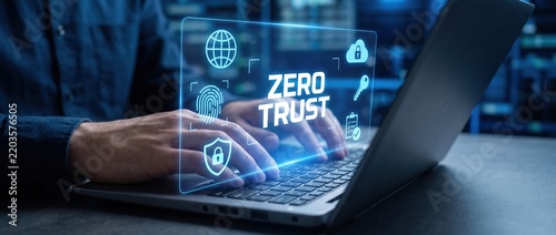 hands typing on laptop with zero trust security concept