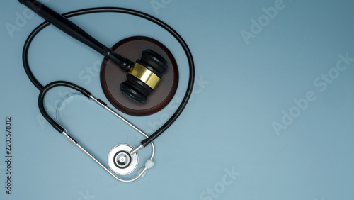 Bild auf Leinwand Judge gavel with stethoscope represents ethical medicine law justice malpractice