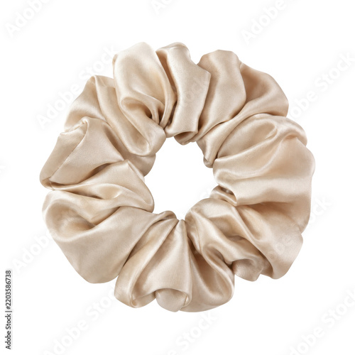 Single elegant beige silk scrunchie, neatly arranged with soft folds, captured on a clean white background with even lighting