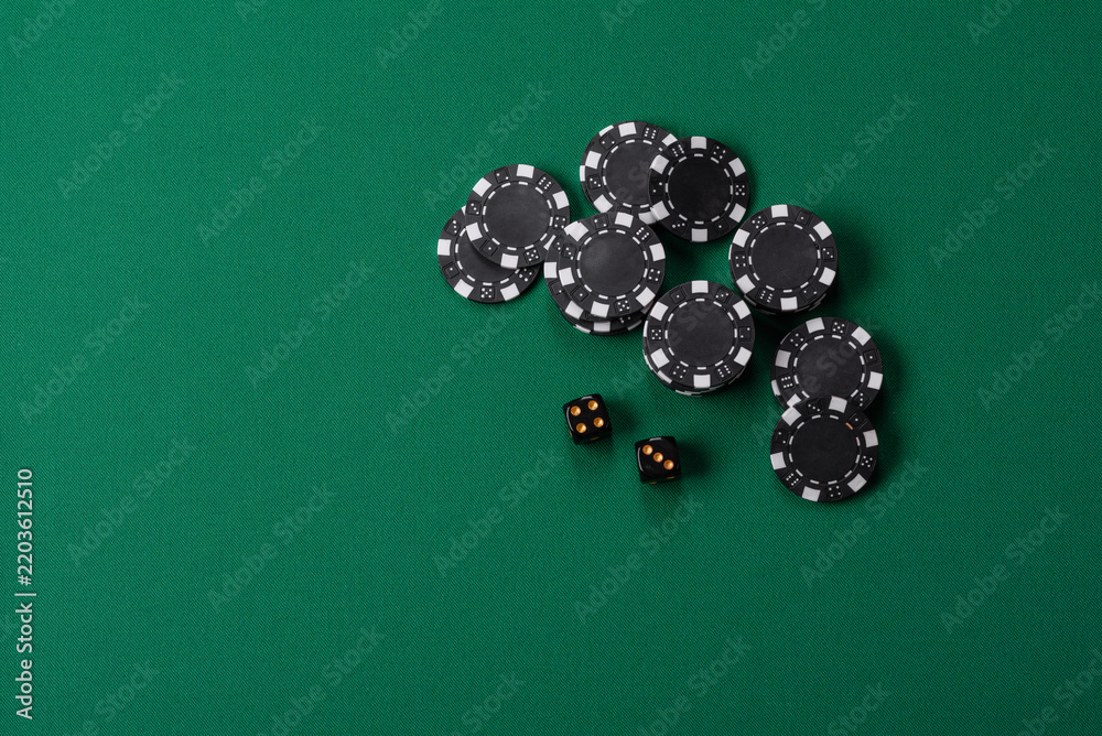 Obraz premium Multicolored casino chips as a conceptual backdrop for gambling games like poker, blackjack