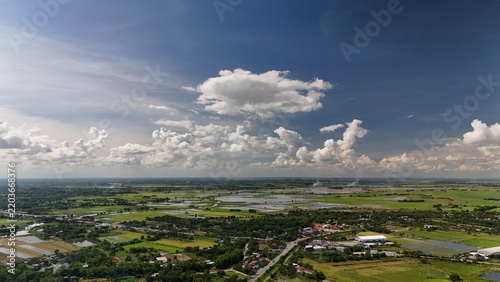 Aerial view of rice field countryside with blue sky and white clouds Agricultural Farmland