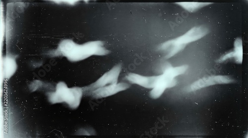 abstract blurred ethereal shapes on dark background
