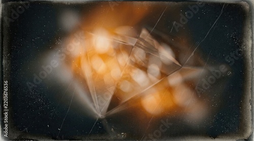 Abstract diamond with warm bokeh lights and dark background