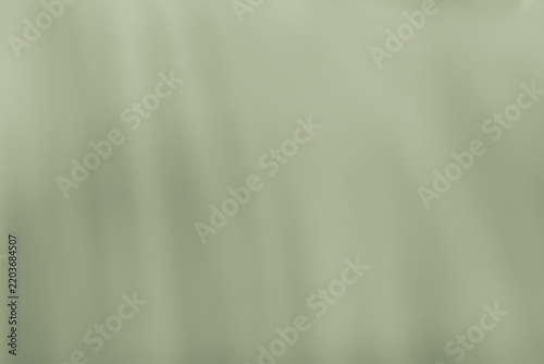 Pale green fabric with gentle waves a soft textile background