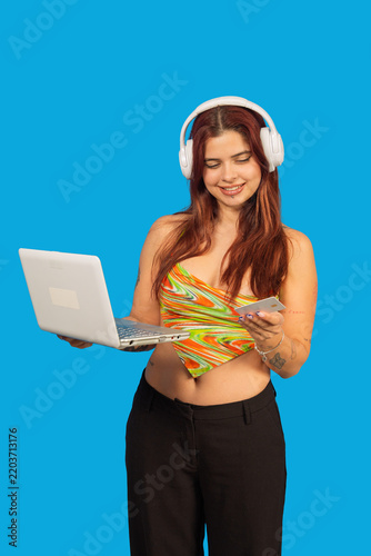 Woman shopping online using laptop and credit card