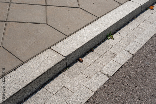 Concrete road curb on pavement road