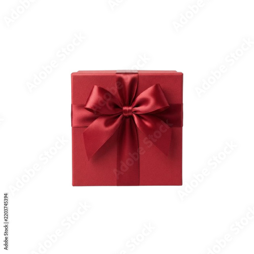 A red gift box with a satin ribbon and bow sits against a white background present package parcel container wrapping crimson scarlet knot tied festive