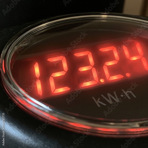 Close-up of glowing red digital kilowatt hour meter