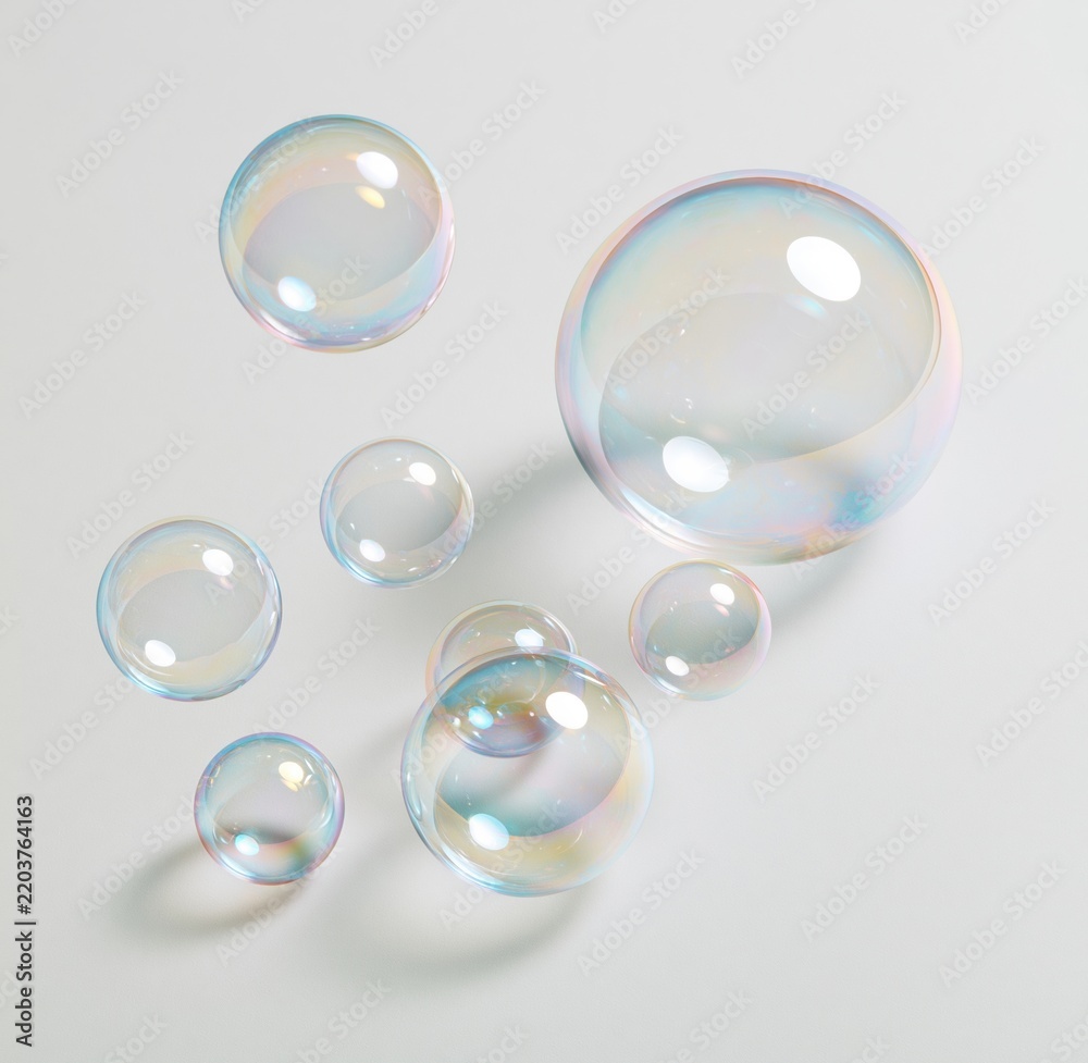 Obraz premium Colorful iridescent soap bubbles floating on white background