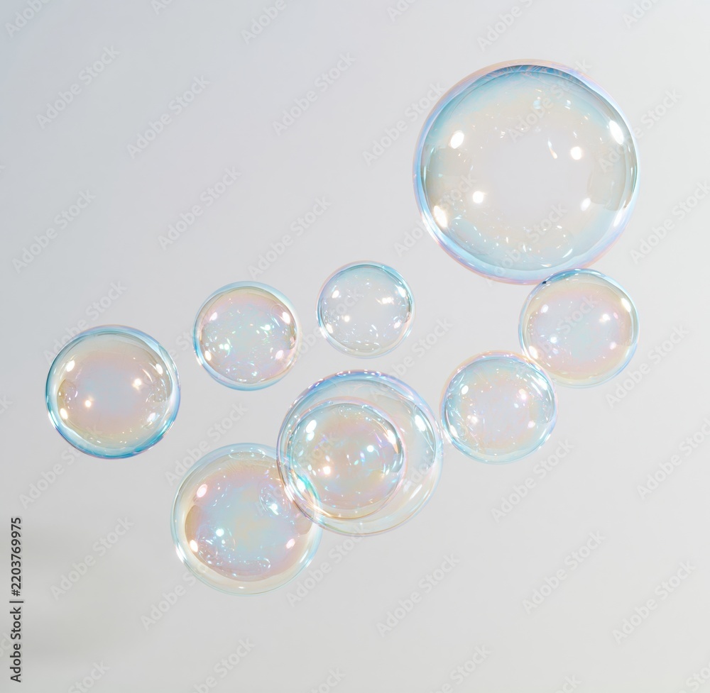 Obraz premium Colorful soap bubbles floating against white background