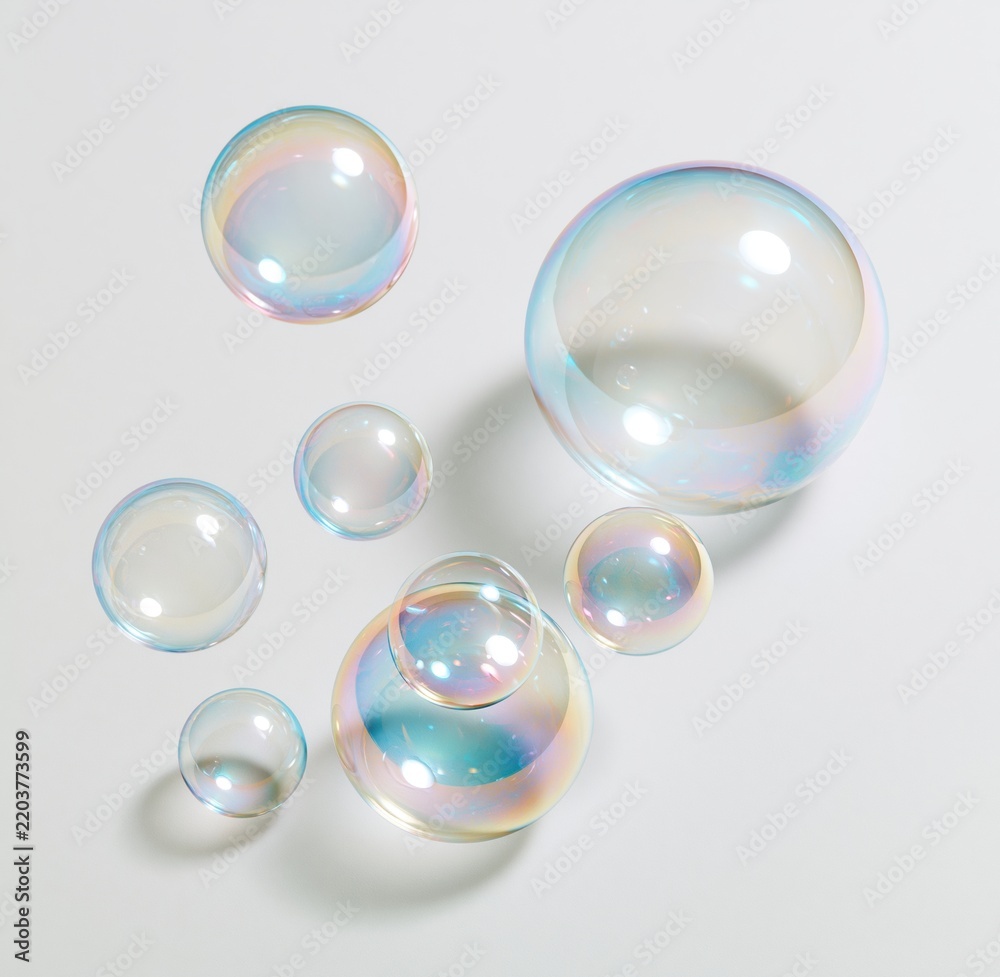 Obraz premium Colorful soap bubbles floating on white background
