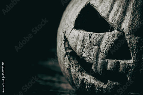 Carved jack-o'-lantern pumpkin in the dark
