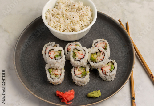 Obraz na plátně california sushi rolls served with a side pf rice