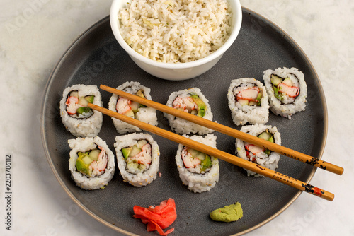 Obraz na plátně california rolls served with a side pf rice