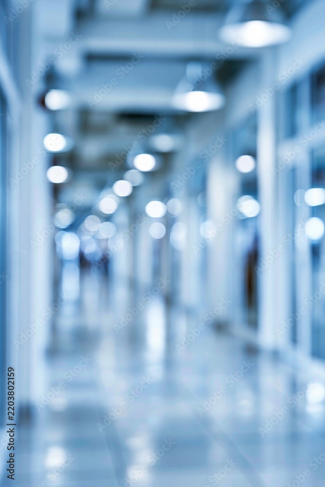 Obraz premium blurred blue hallway with bokeh lights in office