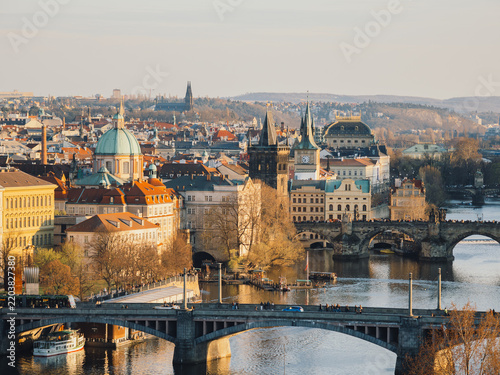 Картината върху платно Charles bridge over Vltava river with historic buildings and dome in sunset ligh