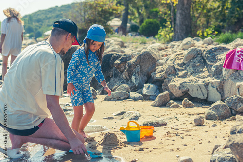 Father and Daughter Enjoying Quality Time Playing Together on the Beach