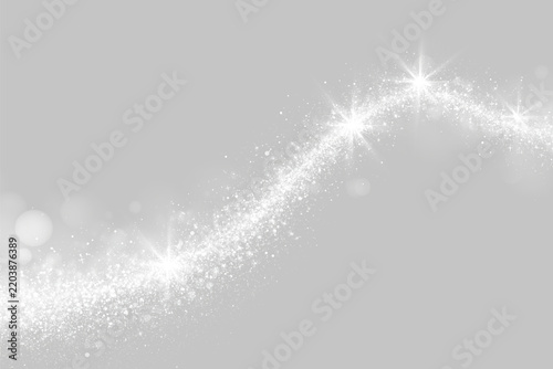 A sweeping trail of silver glitter curves gently across a dark background. Bright sparkling stars enhance its shimmering effect with radiant light bursts. It creates a sense of magical.