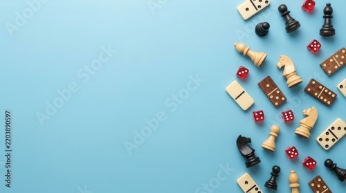 Space for text with board games components in a flat lay composition on a light blue background