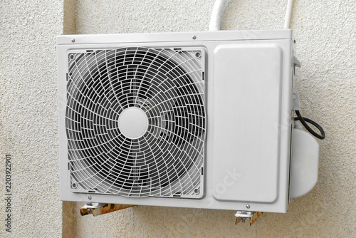 Картината върху платно Air conditioner compressor heat pump fan equipment machine on the wall