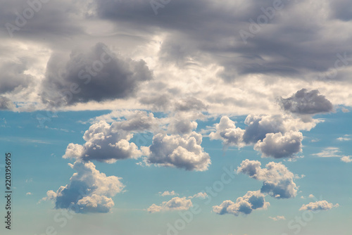 Bild auf Leinwand Dramatic Cloudscape With Puffy Cumulus Clouds and Stormy Sky Over Blue Horizon
