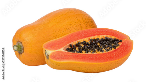 Whole ripe orange papaya fruit and half cut revealing black seeds, isolated on transparent background