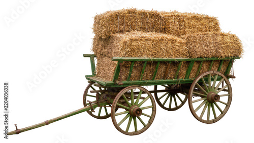 Green wooden hay cart loaded with rectangular straw bales, isolated on transparent background