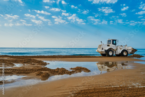Excavator Working On The Beach