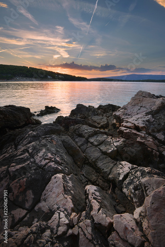 Sunset over rocky sea coast in Croatia with dramatic sky