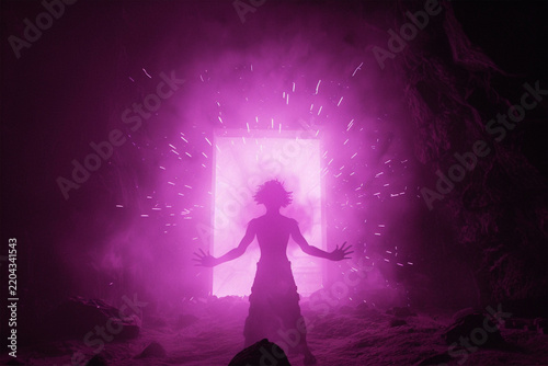 Silhouette of a man summoning energy with glowing purple aura inside a dark cave