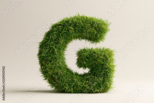 Letter G shaped from dense green grass on neutral background